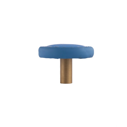 The Mantara L-0008 Sofia Round Knob is a modern leather knob in Blue, ideal for cabinets and wardrobes.