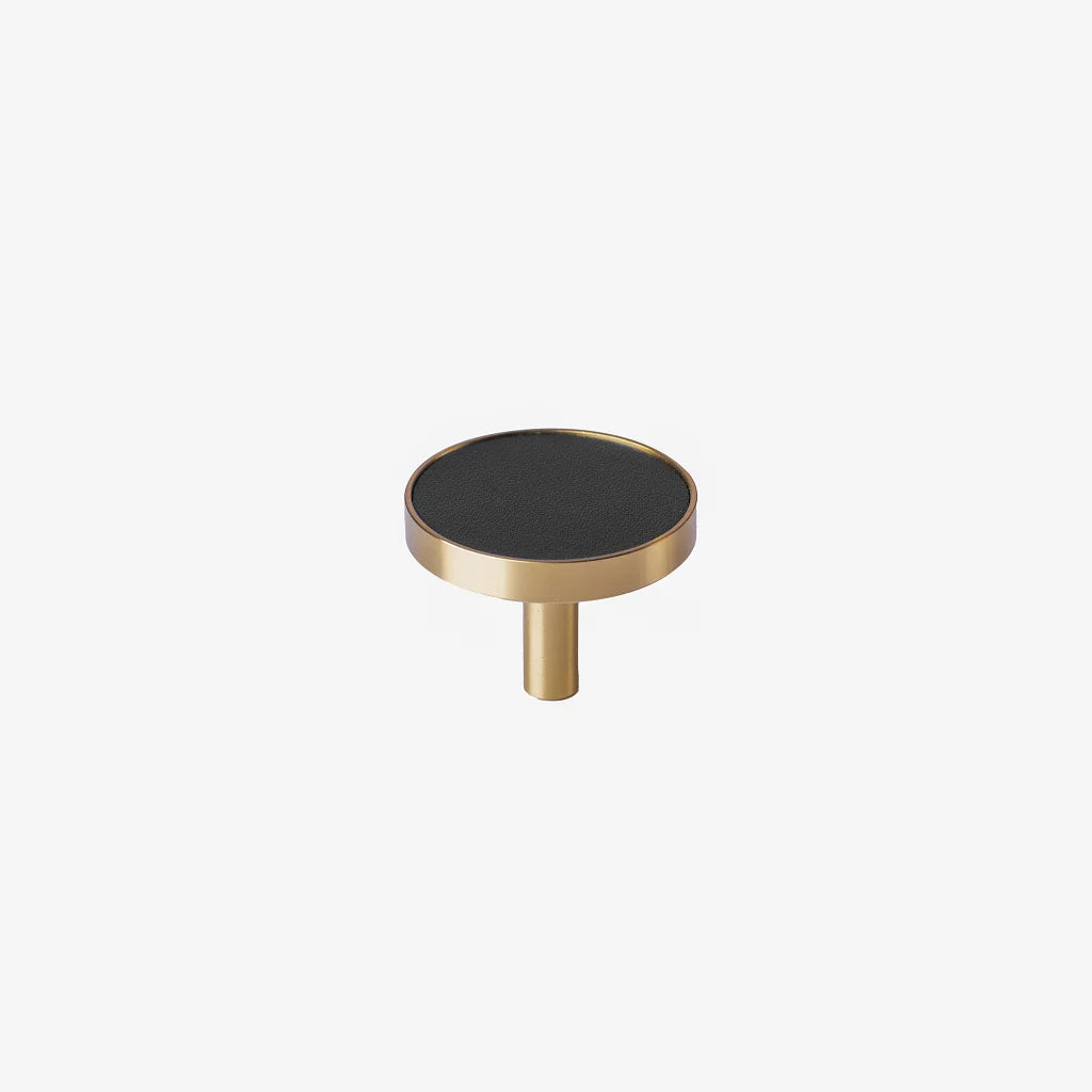 The Mantara L-0004 Obsidian Knob is a modern brass and leather knob in black, perfect for wardrobes, kitchens, and cabinets.