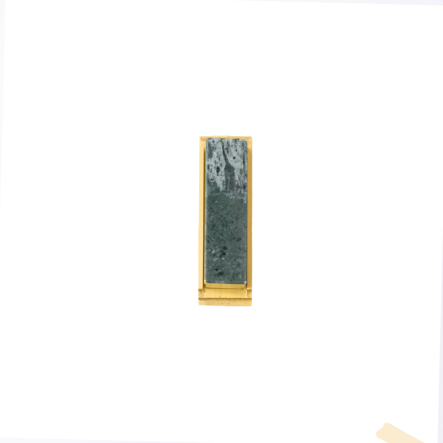 The Mantara M-0010 Fuji Handle is a modern marble and brass handle in green, ideal for kitchens, cabinets, and bathrooms.