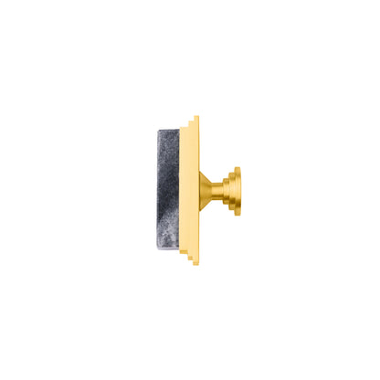 The Mantara M-0010 Fuji Handle is a modern marble and brass handle in grey, ideal for kitchens, cabinets, and bathrooms.