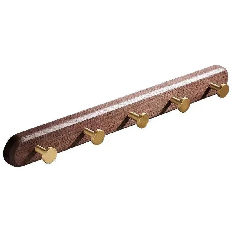Mantara Calista Hook W-0011 is a modern walnut wood &amp; brass wall hook in gold with brushed finish, ideal for homes &amp; hotels.