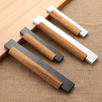 Mantara Oakley Handle W-0033 is a modern zinc alloy and beech wood handle in silver and black, ideal for kitchen and dresser drawers.