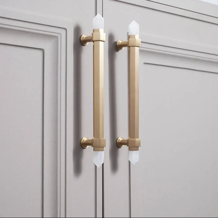 The Mantara C-0015 Quartz Handle is a modern brass and crystal handle in white, ideal for doors, wardrobes, and cabinets.