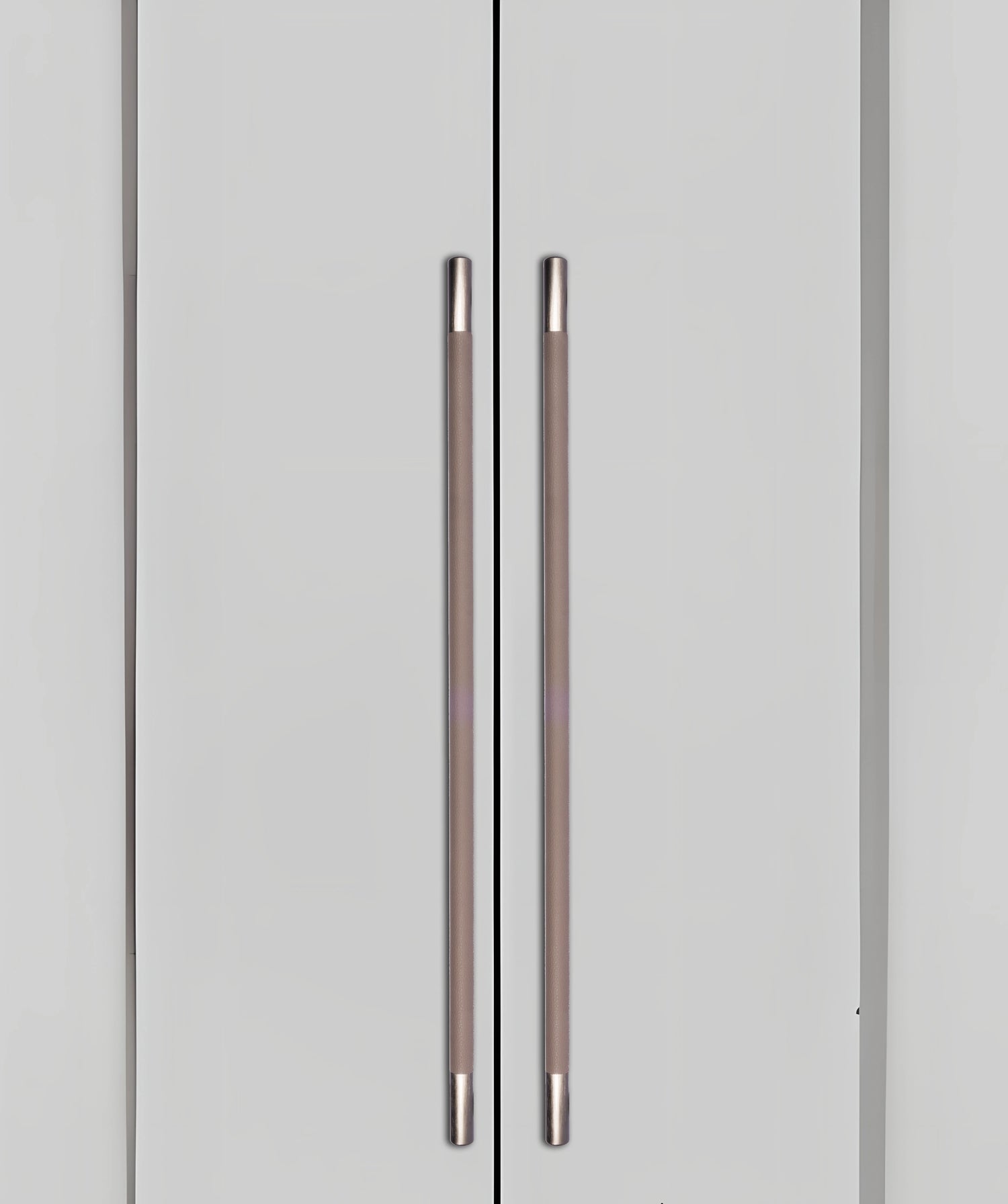 Gray cabinet doors with sleek metallic handles, blending seamlessly into a gray background, styled by Mantara.
