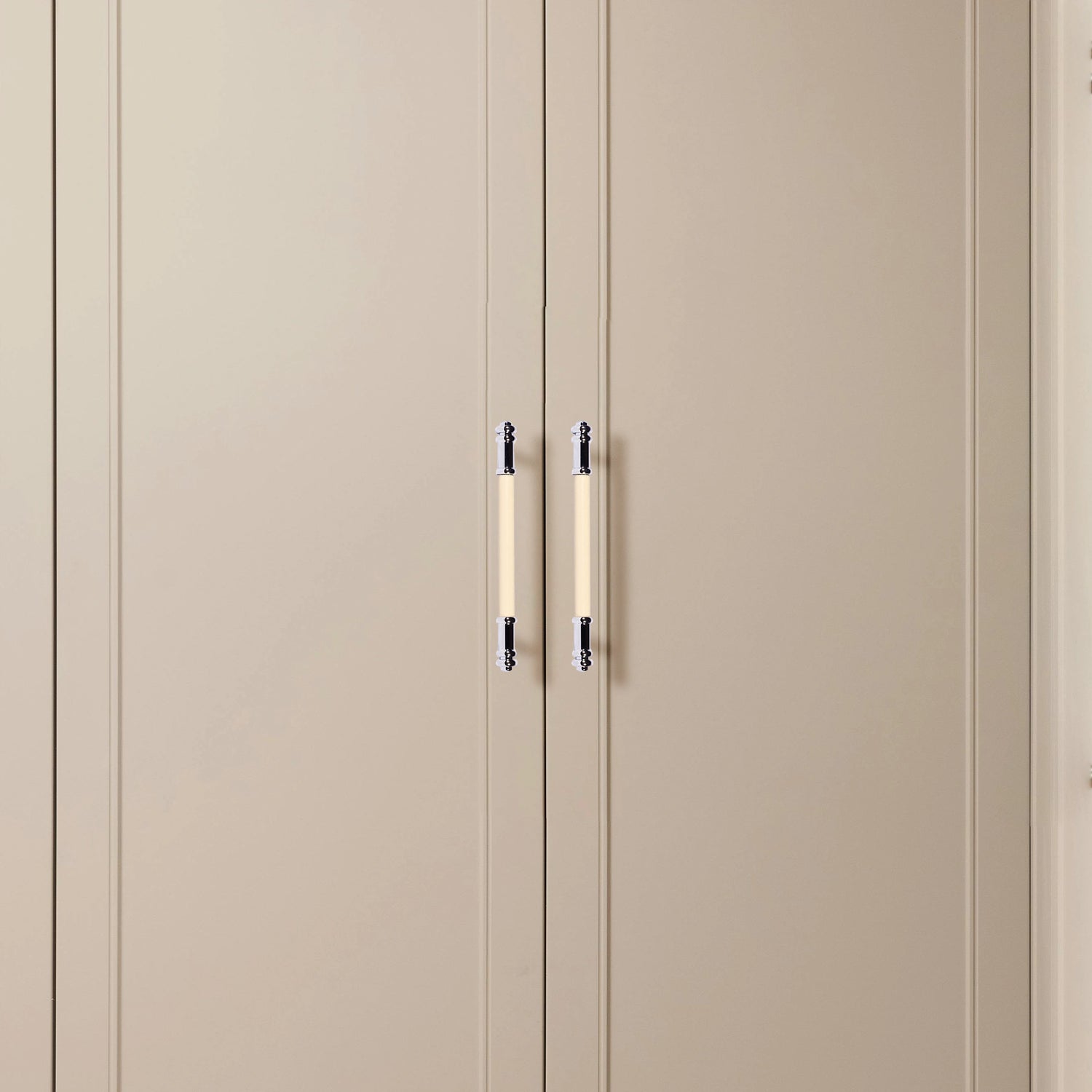 Beige wardrobe with two doors and sleek metallic handles, offering a soft, contemporary look by Mantara.