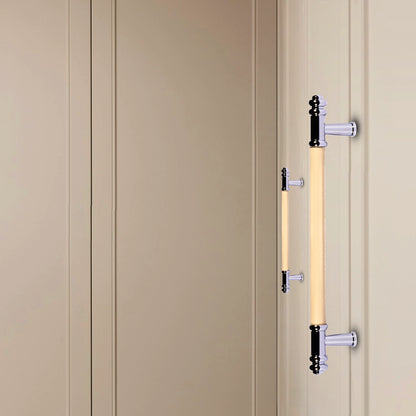 Beige cabinet with decorative handles set against a matching beige background, creating a subtle, elegant look by Mantara.