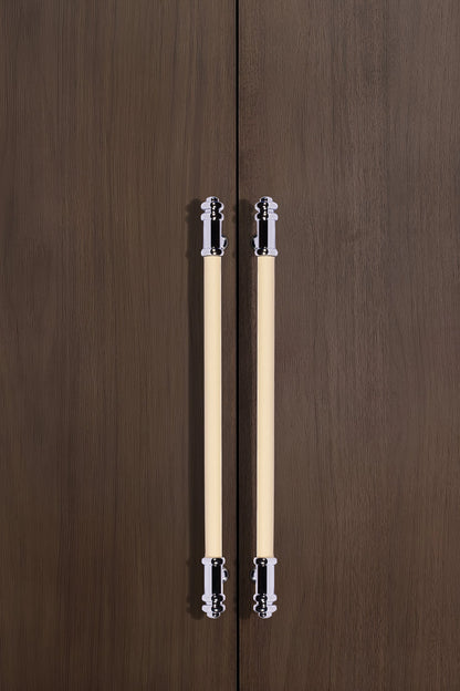 Pair of wooden pencils with metal clips placed on a wooden surface, showcasing a simple, refined design by Mantara.