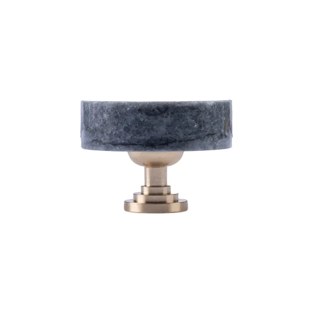 The Mantara M-0001 Theo Knob is a modern marble and brass knob in Grey, ideal for doors, drawers, and cabinets.