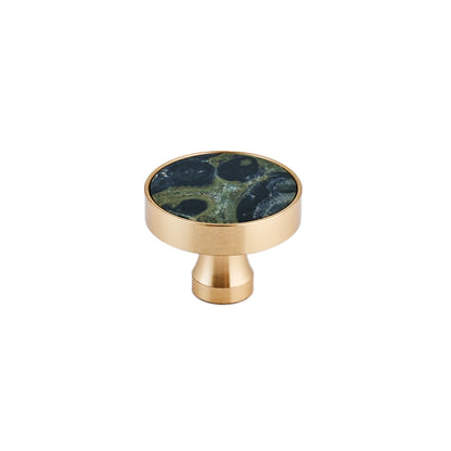The Mantara M-0004 Carrara Knob is a modern stone and brass knob in Peacock stone, ideal for drawers and cabinets.