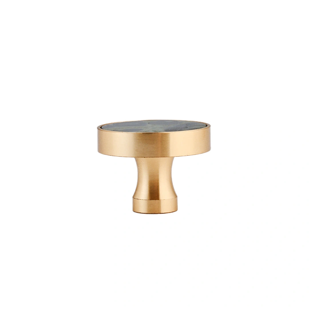 The Mantara M-0004 Carrara Knob is a modern stone and brass knob in Peacock stone, ideal for drawers and cabinets.