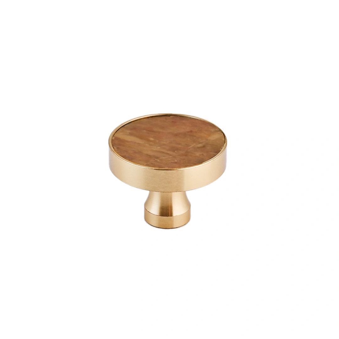 The Mantara M-0004 Carrara Knob is a modern stone and brass knob in  Red jade , ideal for drawers and cabinets.