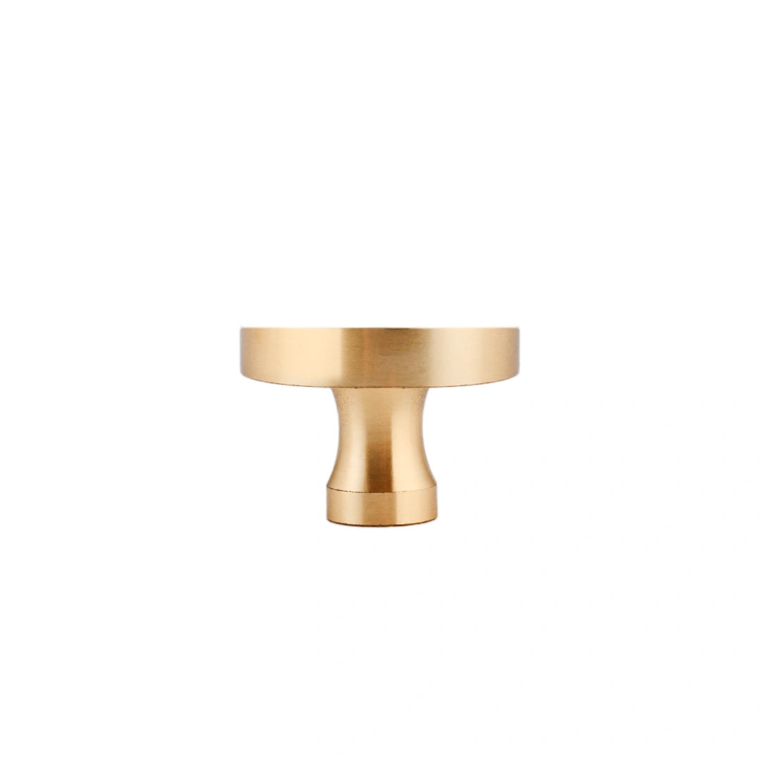 The Mantara M-0004 Carrara Knob is a modern stone and brass knob in  Red jade , ideal for drawers and cabinets.