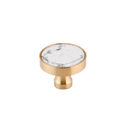 The Mantara M-0004 Carrara Knob is a modern stone and brass knob in white, ideal for drawers and cabinets.