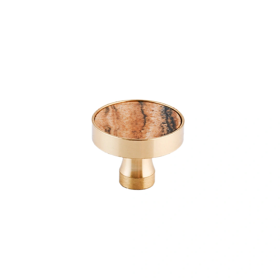 The Mantara M-0004 Carrara Knob is a modern stone and brass knob in Zebra stone, ideal for drawers and cabinets.