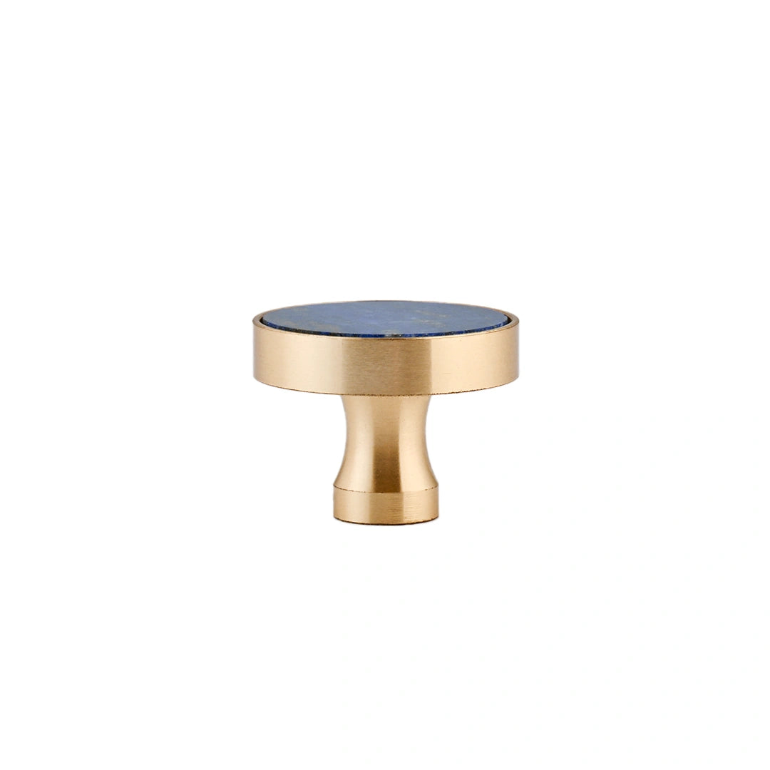 The Mantara M-0004 Carrara Knob is a modern stone and brass knob in  Blue , ideal for drawers and cabinets.