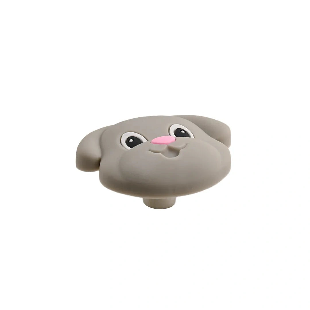 Gray dog-shaped cabinet knob with cartoon eyes, pink nose, and floppy ears on a white background.
