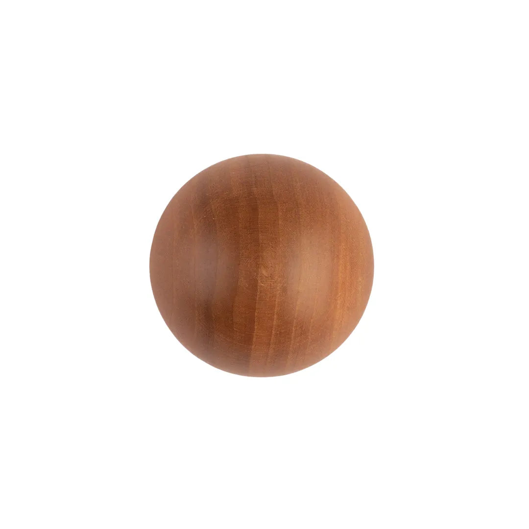 A round wooden knob with a warm medium-brown finish and visible wood grain, centered on a plain white background.