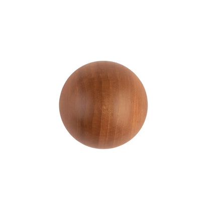 A round wooden knob with a warm medium-brown finish and visible wood grain, centered on a plain white background.