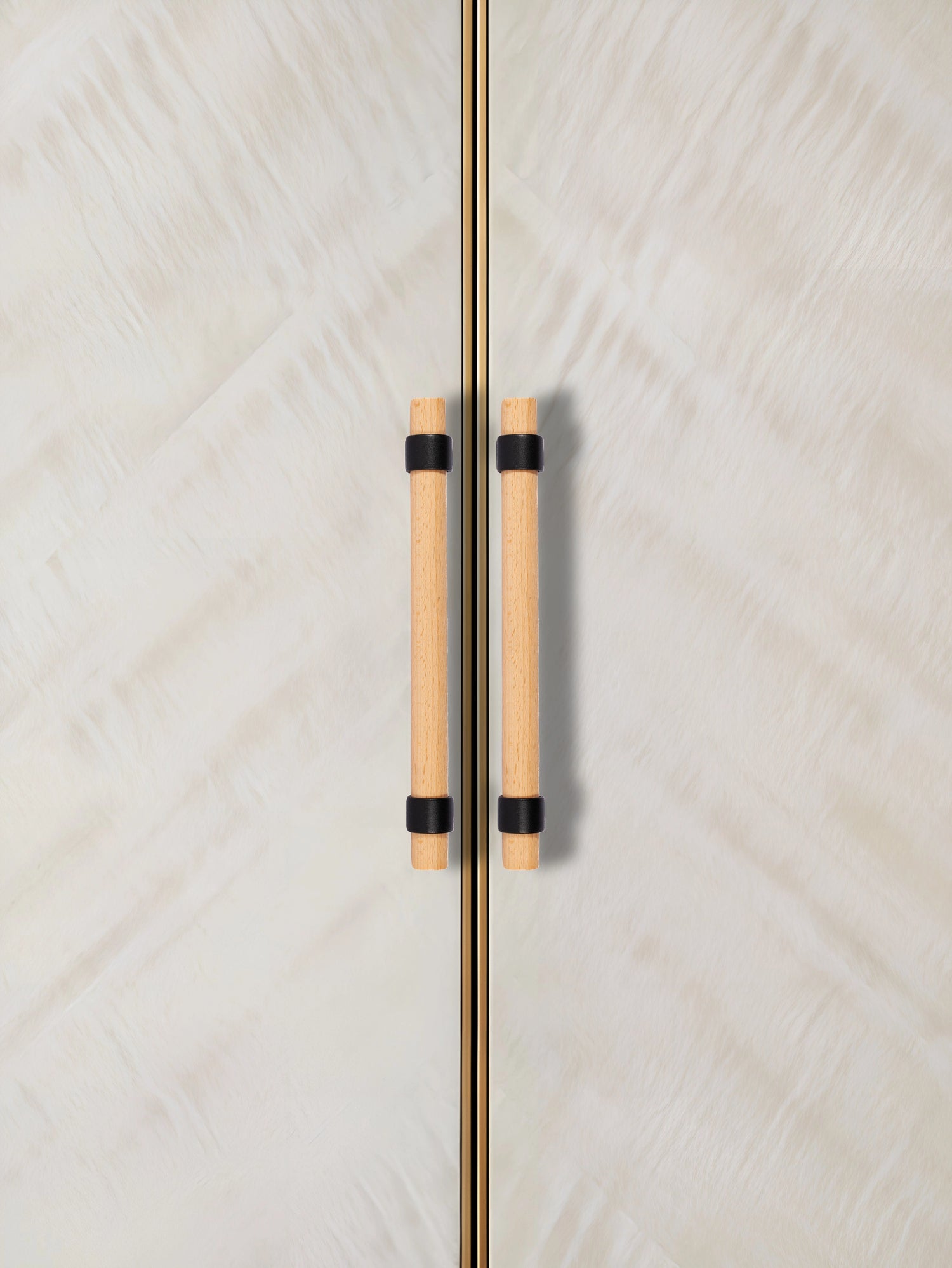 Close-up of a door with wooden handles, set against a textured white background—natural warmth meets simplicity by Mantara.