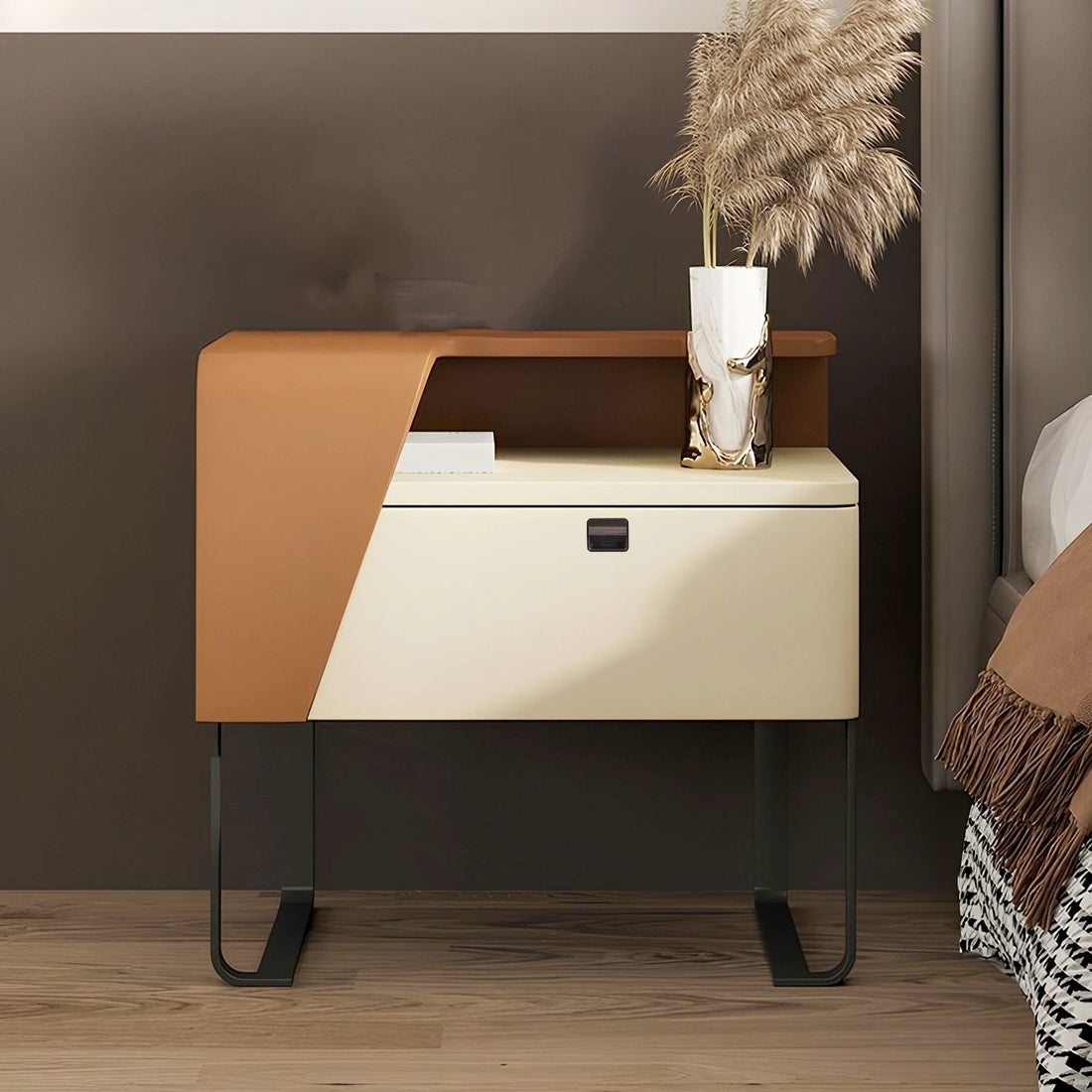 Modern nightstand with a geometric front and a subtle knob, styled in a cozy bedroom setting—designed by Mantara.

