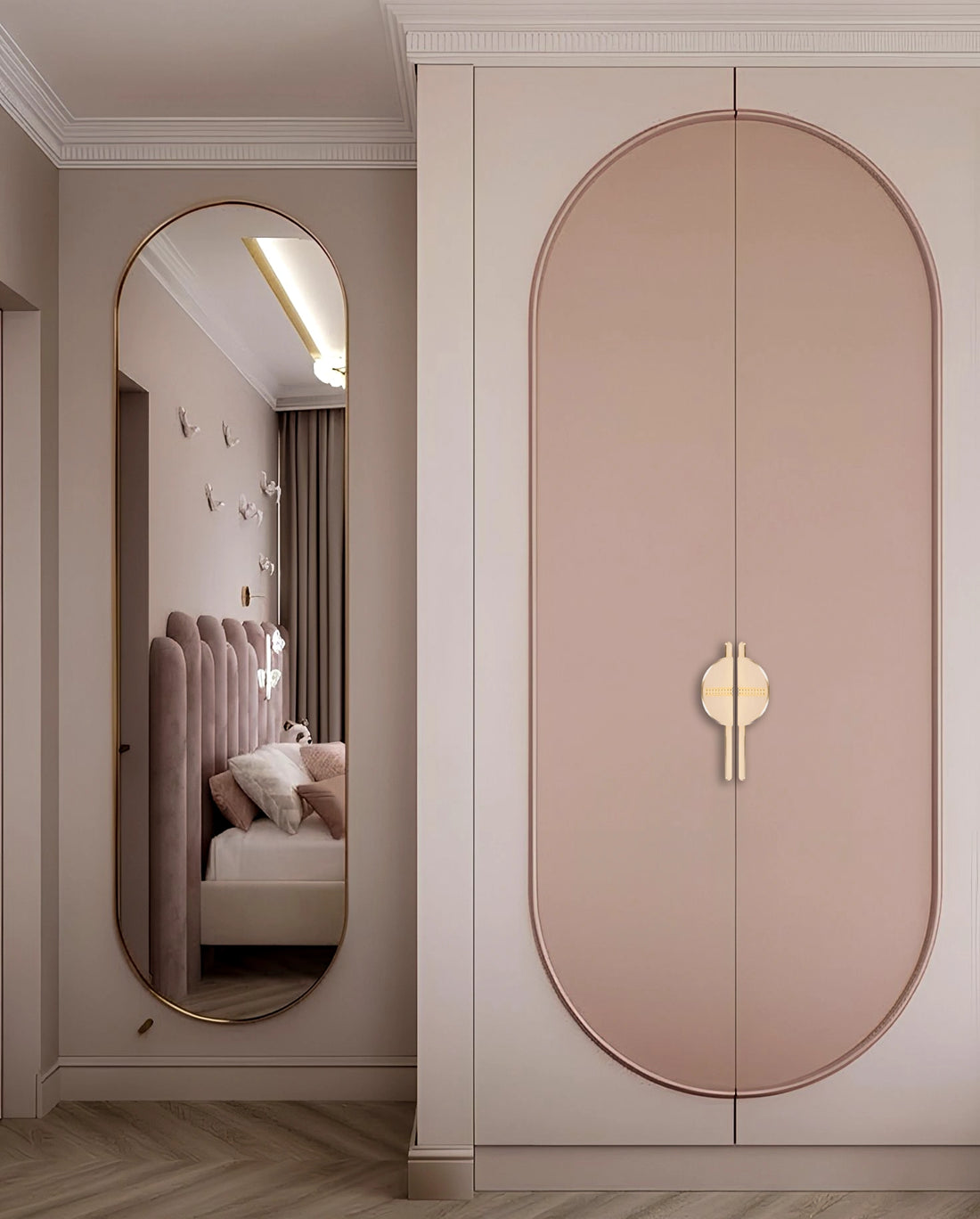 Pink wardrobe with sleek handles and mirror reflection, styled in a cozy bedroom setting with soft tones—by Mantara.