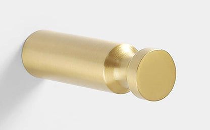 Mantara Amara Hook B-0092 is a modern brushed brass wall hook in gold, ideal for bathrooms, bedrooms, and living areas.