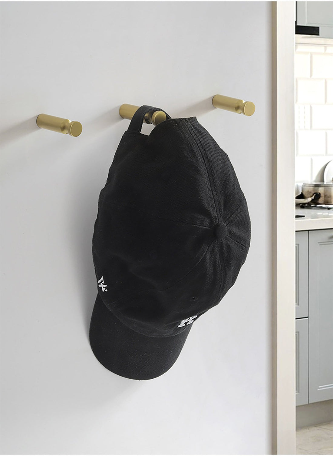 Mantara Amara Hook B-0092 is a modern brushed brass wall hook in gold, ideal for bathrooms, bedrooms, and living areas.