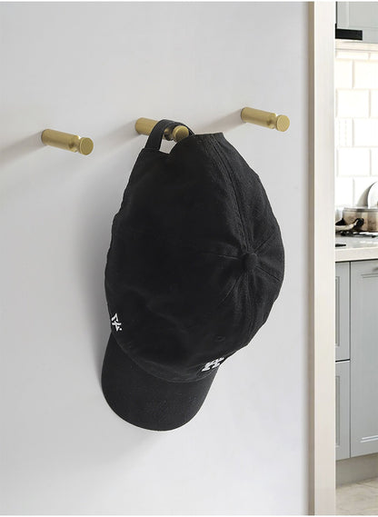 Mantara Amara Hook B-0092 is a modern brushed brass wall hook in gold, ideal for bathrooms, bedrooms, and living areas.