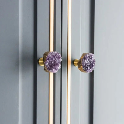 The Mantara C-0026 Amethyst Knob is a modern crystal and brass knob in purple, ideal for drawers, cabinets, and kitchens.