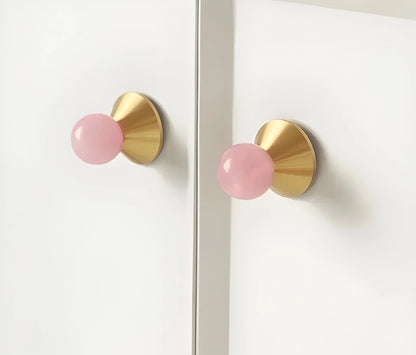 Crystal and brass round cabinet knob in pink finish by Mantara, model Astro Knob with  C-0021.