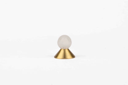 The Mantara C-0021 Astro Knob is a modern crystal and brass knob in white, perfect for drawers and cabinets.