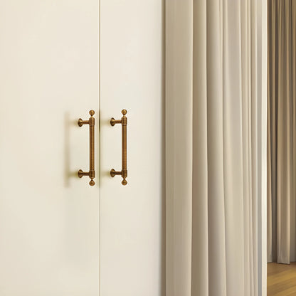 The Mantara B-0127 Caelum Handle is a modern brass handle in bronze and gold, perfect for kitchen drawers, cabinets, and furniture.
