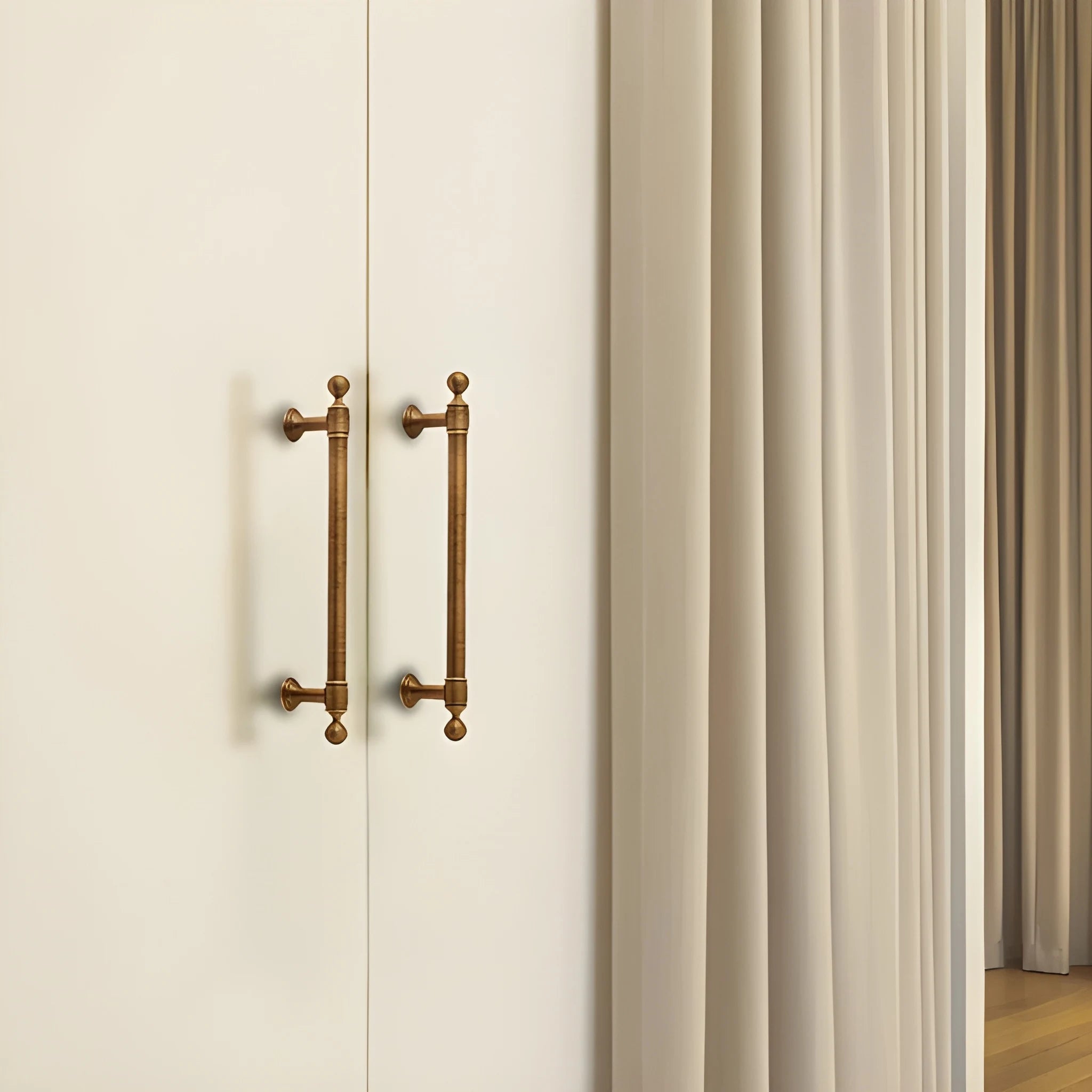 The Mantara B-0127 Caelum Handle is a modern brass handle in bronze and gold, perfect for kitchen drawers, cabinets, and furniture.