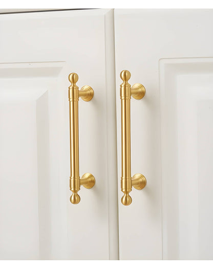 The Mantara B-0127 Caelum Handle is a modern brass handle in bronze and gold, perfect for kitchen drawers, cabinets, and furniture.
