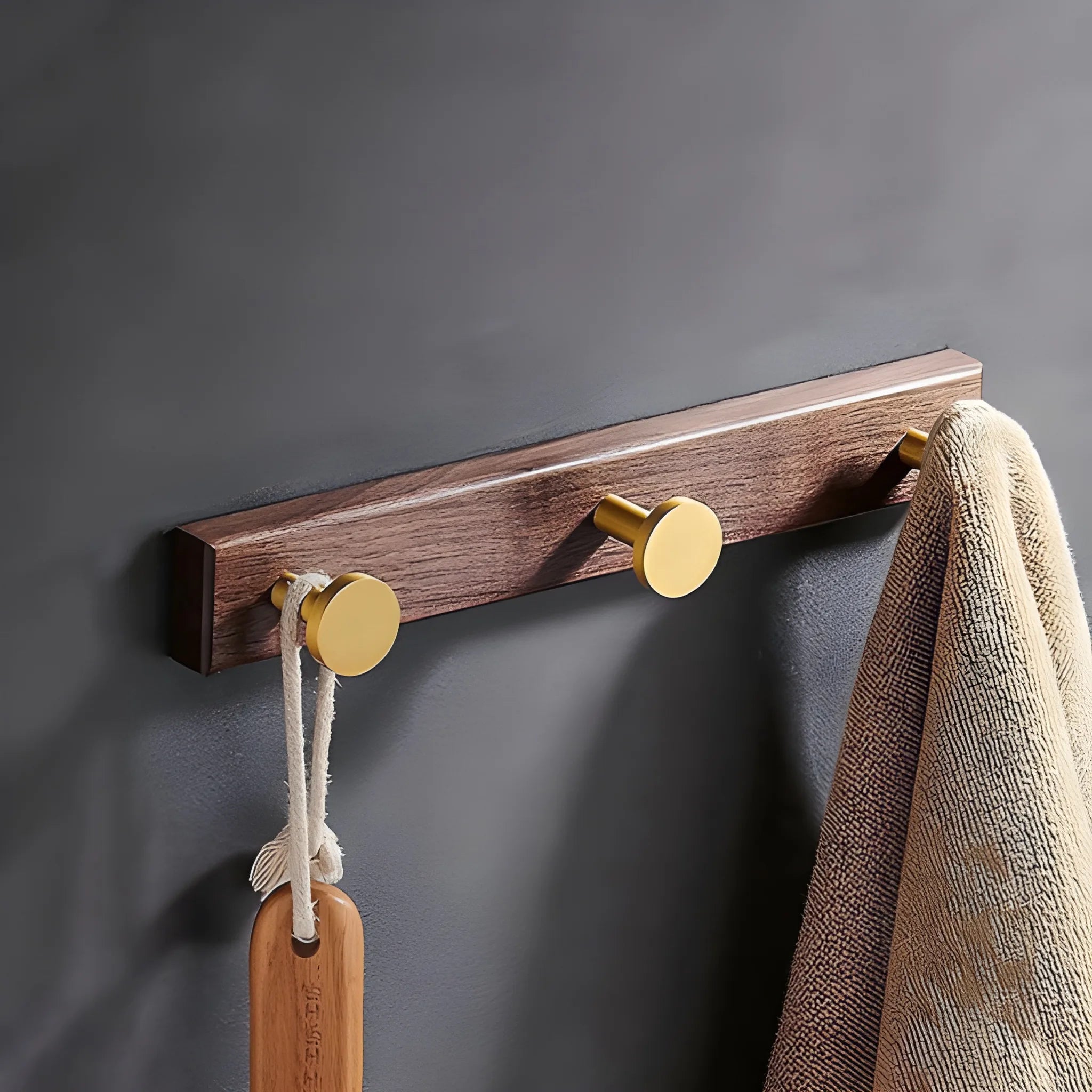 Mantara Calista Hook W-0011 is a modern walnut wood &amp; brass wall hook in gold with brushed finish, ideal for homes &amp; hotels.