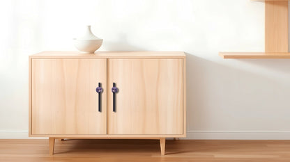 The Mantara C-0027 Calyx Handle is a modern crystal handle in black+purple, ideal for cabinets, wardrobes, and drawers.