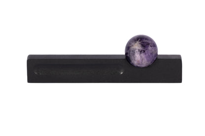 The Mantara C-0027 Calyx Handle is a modern crystal handle in black+purple, ideal for cabinets, wardrobes, and drawers.