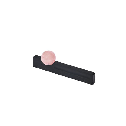 The Mantara C-0027 Calyx Handle is a modern crystal handle in black and pink, ideal for cabinets, wardrobes, and drawers.