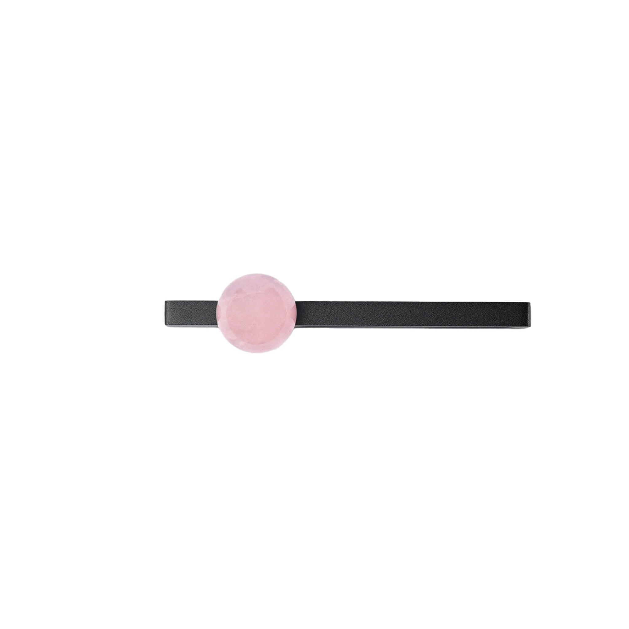 The Mantara C-0027 Calyx Handle is a modern crystal handle in black and pink, ideal for cabinets, wardrobes, and drawers.