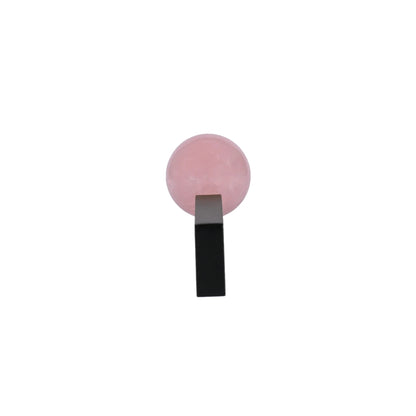 The Mantara C-0027 Calyx Handle is a modern crystal handle in black and pink, ideal for cabinets, wardrobes, and drawers.