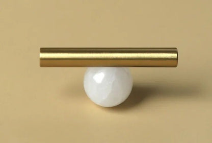 The Mantara C-0020 Chroma T-Bar is a modern crystal and brass knob in white, ideal for drawers and cabinets.