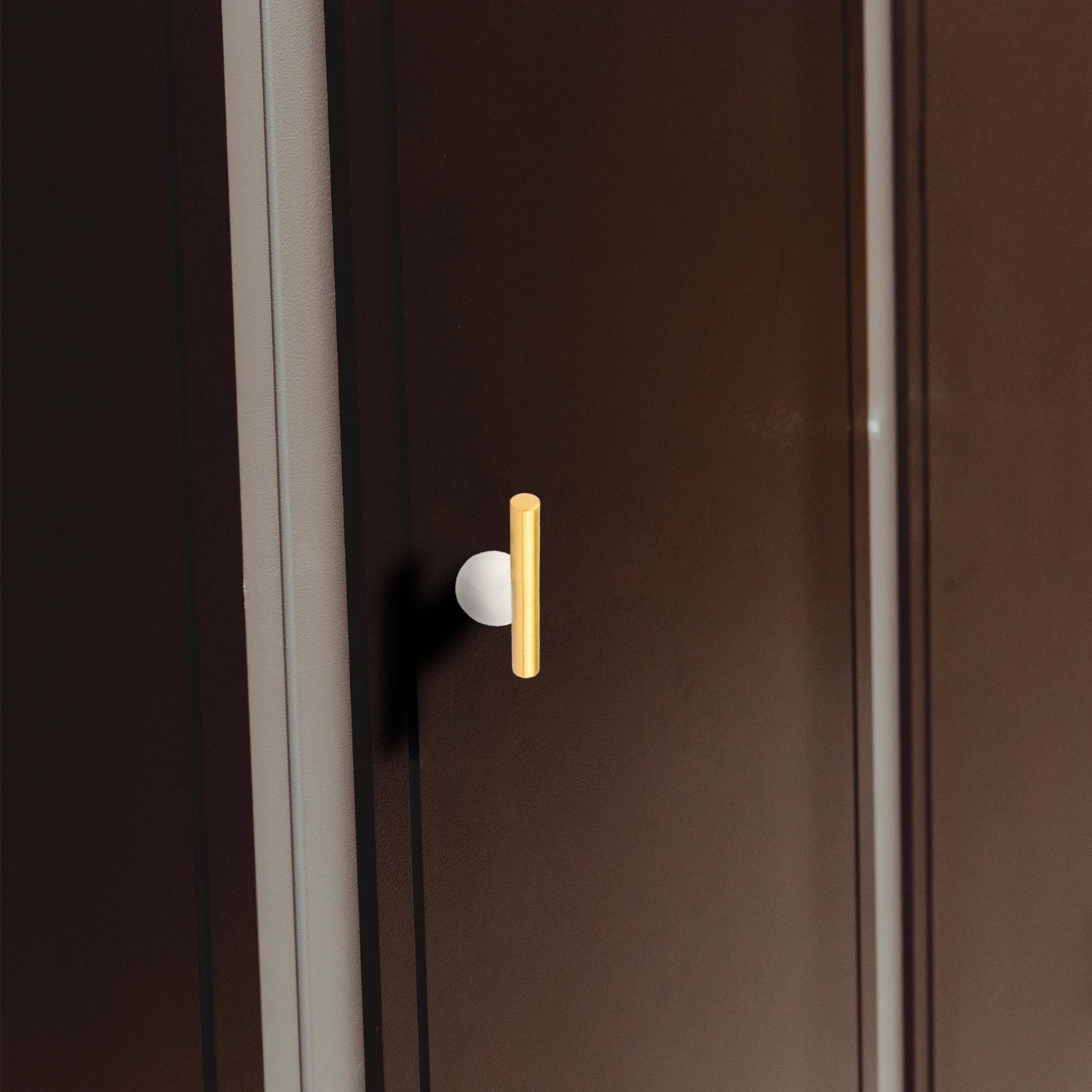The Mantara C-0020 Chroma T-Bar is a modern crystal and brass knob in white, ideal for drawers and cabinets.