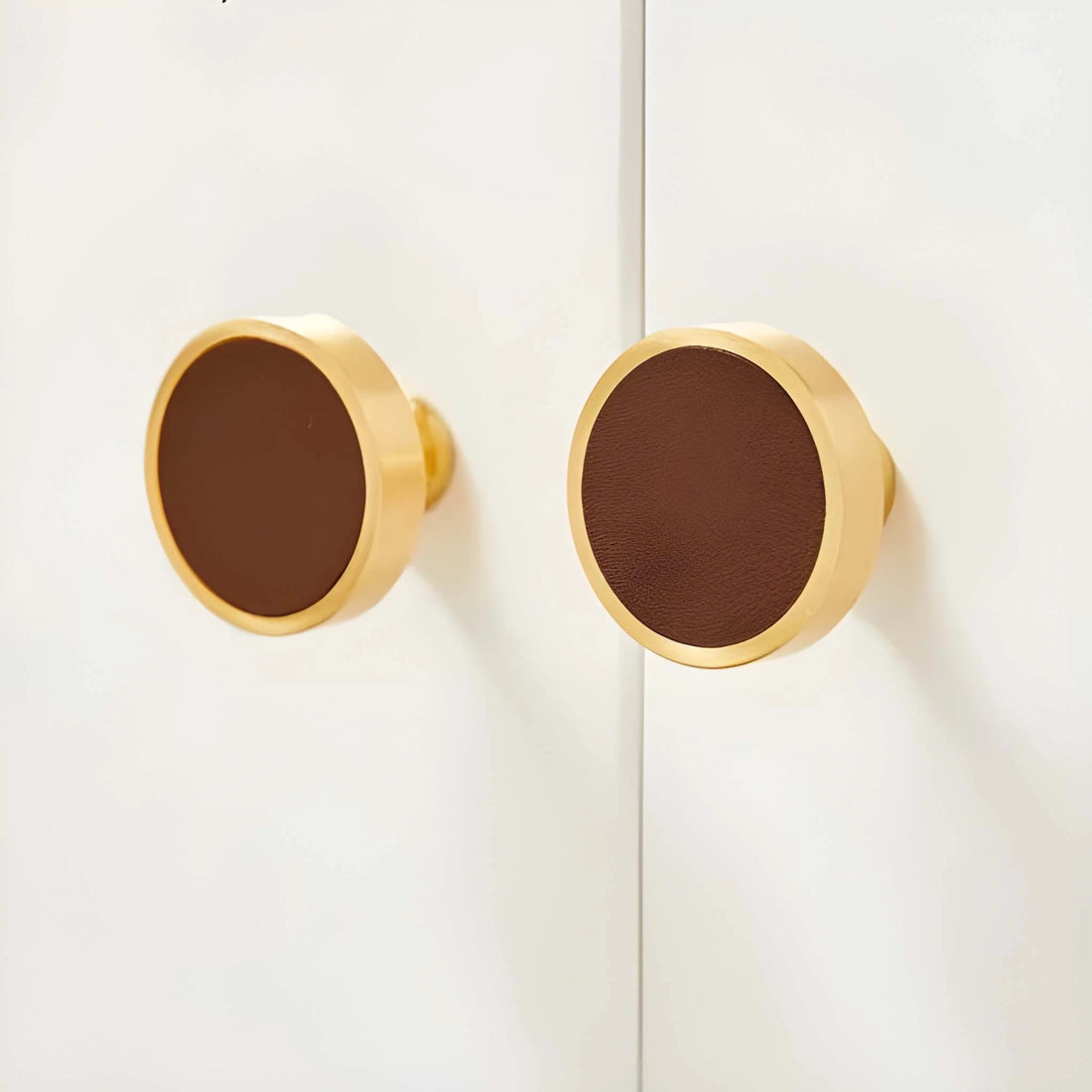 The Mantara L-0014 is a modern leather + brass knob in brown, perfect for kitchen drawers and dressers.