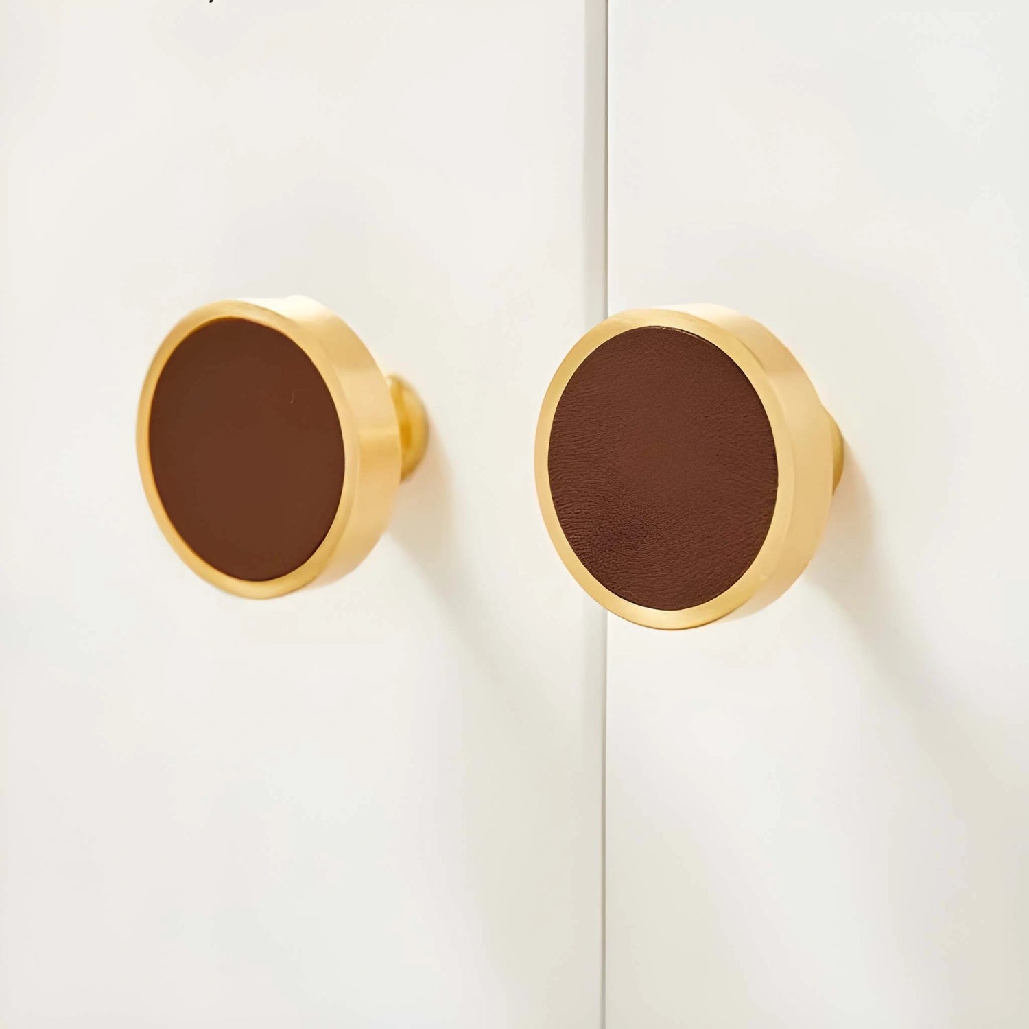 The Mantara L-0014 is a modern leather + brass knob in brown, perfect for kitchen drawers and dressers.