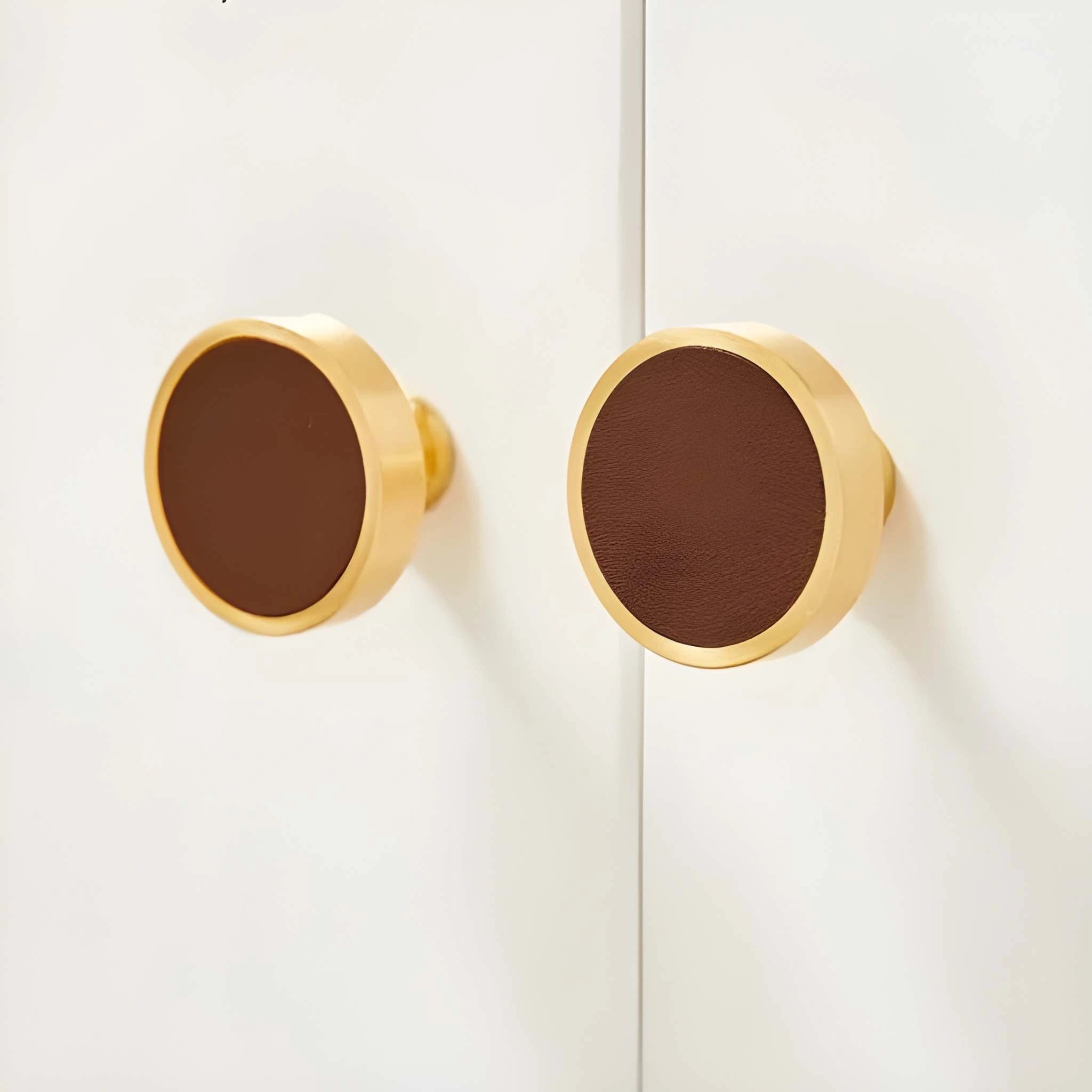 The Mantara L-0014 is a modern leather + brass knob in brown, perfect for kitchen drawers and dressers.