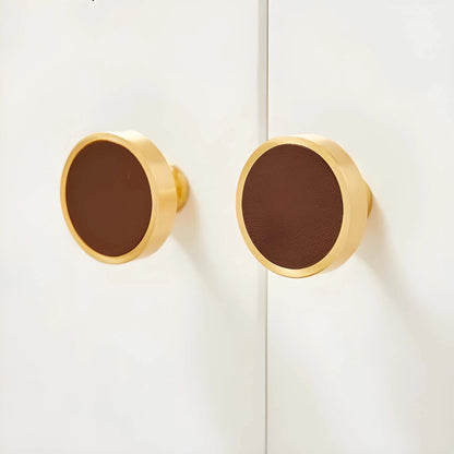 The Mantara L-0014 is a modern leather + brass knob in brown, perfect for kitchen drawers and dressers.
