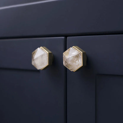 The Mantara C-0005 is a modern crystal + brass knob in white, ideal for cabinets and wardrobes.