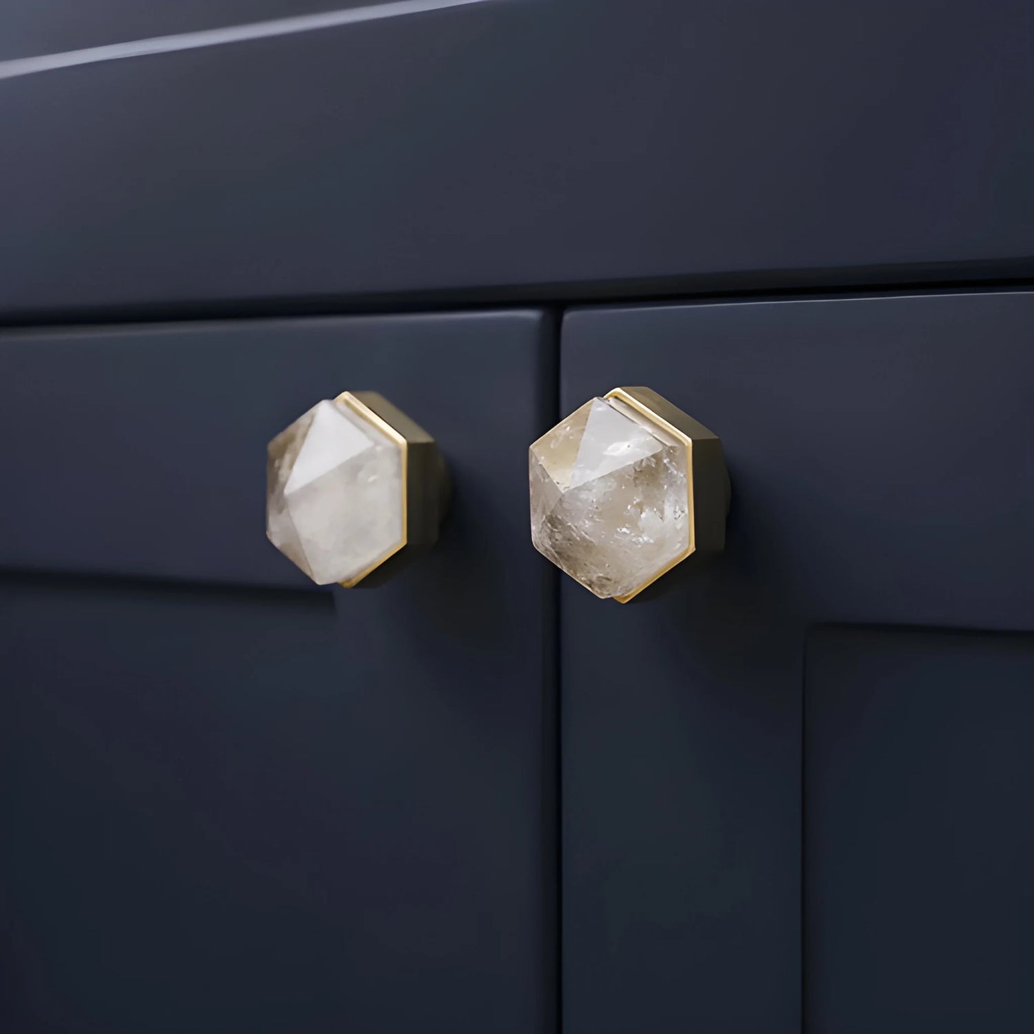 The Mantara C-0005 is a modern crystal + brass knob in white, ideal for cabinets and wardrobes.