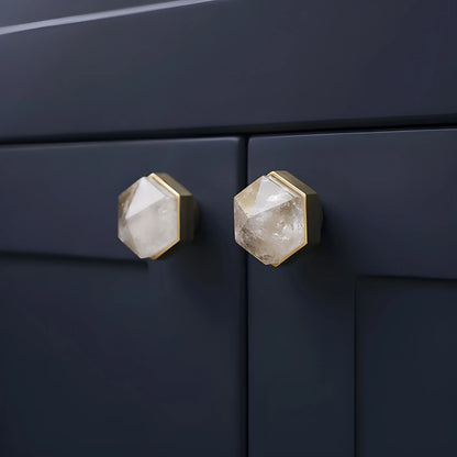 The Mantara C-0005 is a modern crystal + brass knob in white, ideal for cabinets and wardrobes.