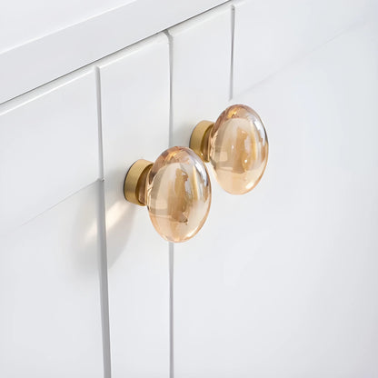 The Mantara C-0008 is a modern artificial crystal + brass knob in champange/brass, ideal for wardrobes and drawers.